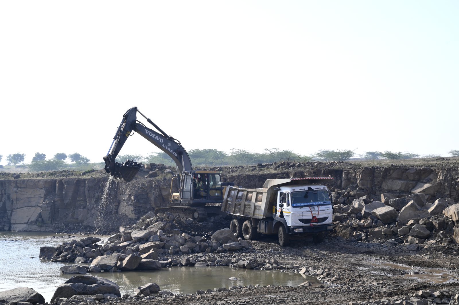 Volvo excavator loading a tipper at the quarry